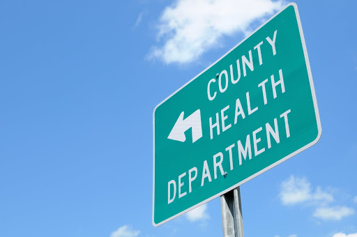 Green County Health Department Road sign against a blue sky 
